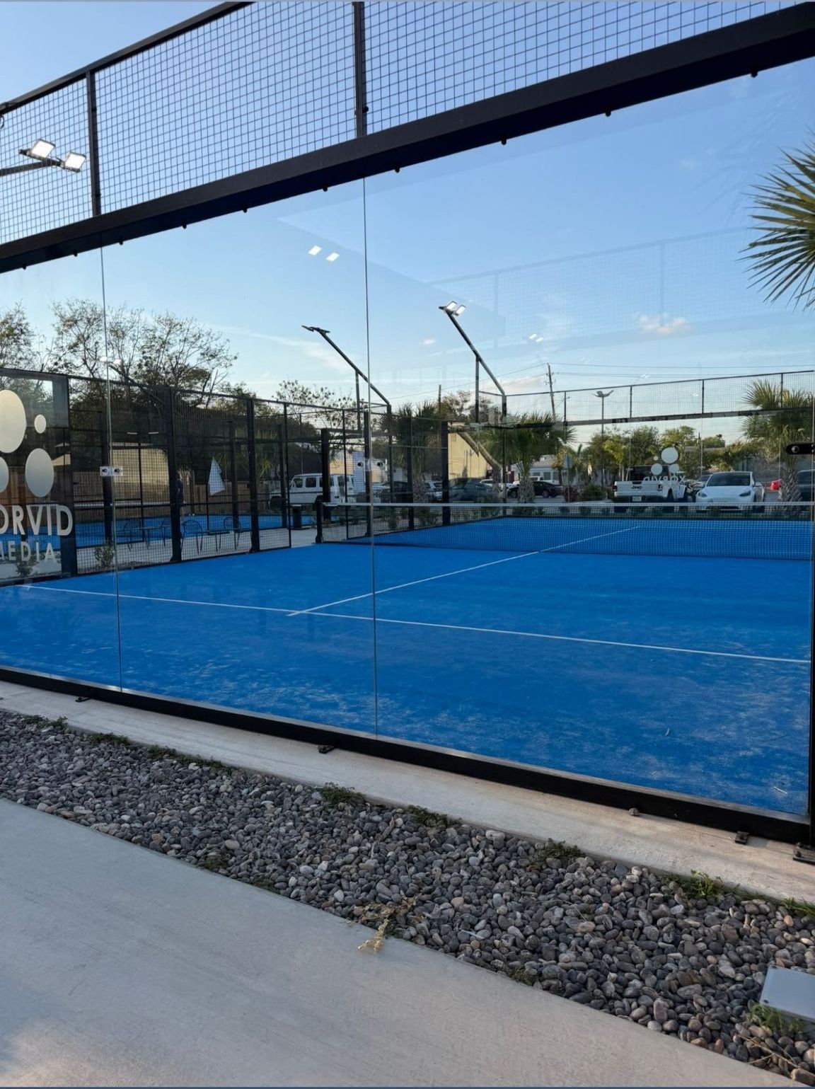 Padel court glass enclosure cleaned by Summit Glass Care